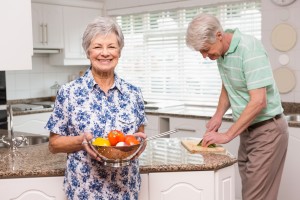 happy senior couple in kitchen