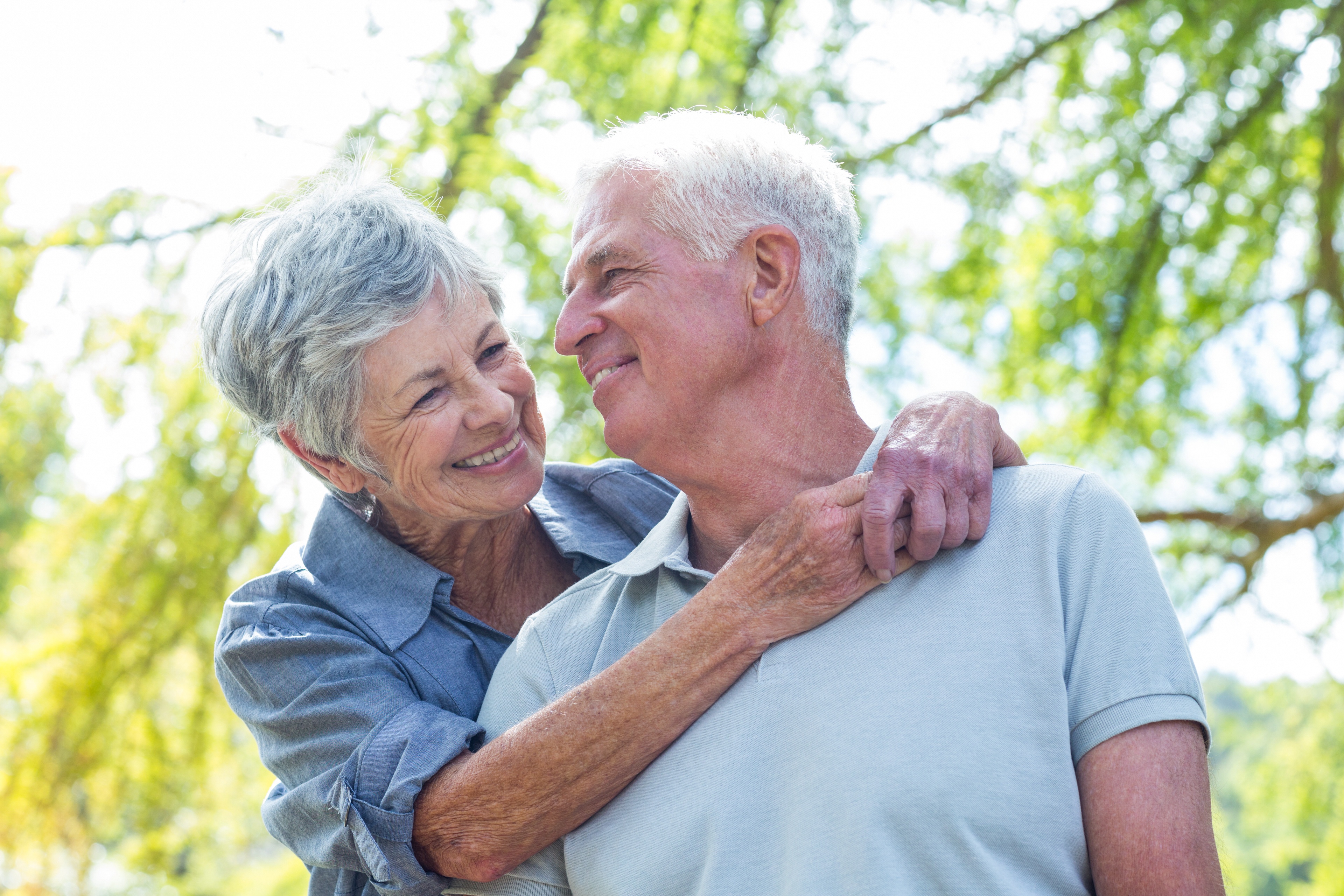 happy senior couple in park